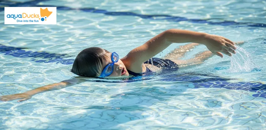 Child performing freestyle breathing with head turned sideways