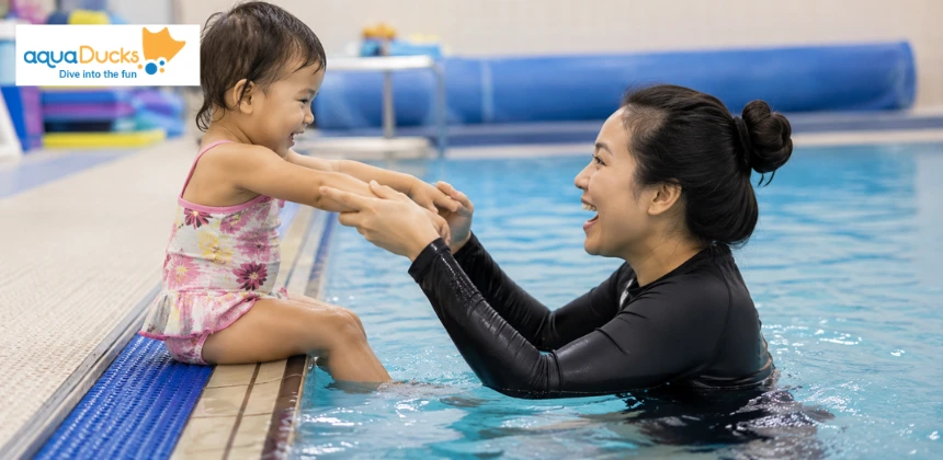Parent playing swimming games for toddlers with a child at the edge, trying engaging swimming pool games for early water safety.