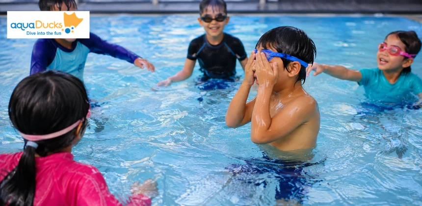 Children playing classic swimming games for kids like Marco Polo, discovering exciting games to play in swimming pool safely.