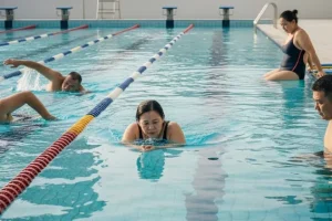 A group of people practicing water exercises to see Does Swimming Help Lose Weight realistically.